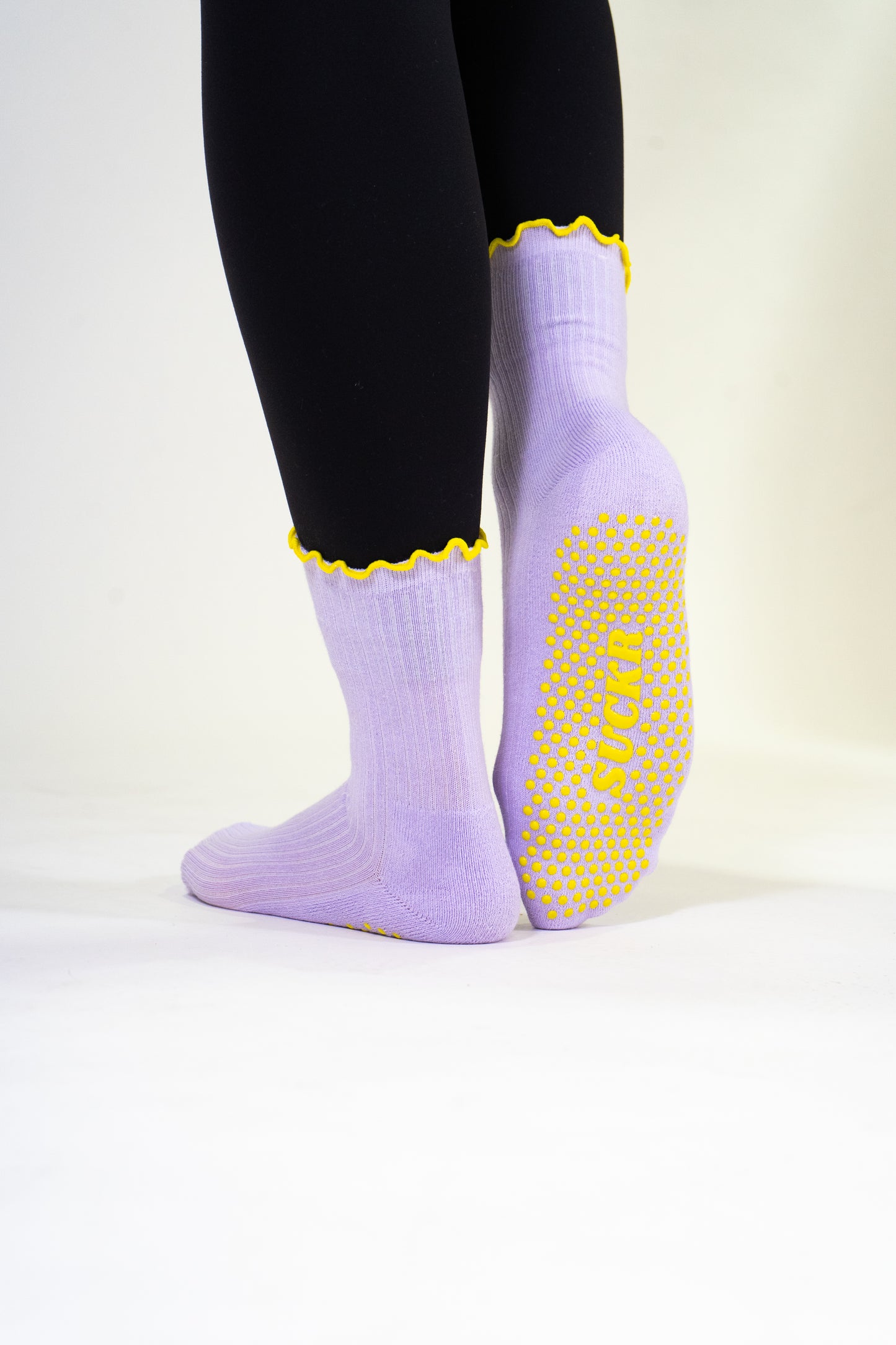 SUCKR purple frill grip socks, standing shot