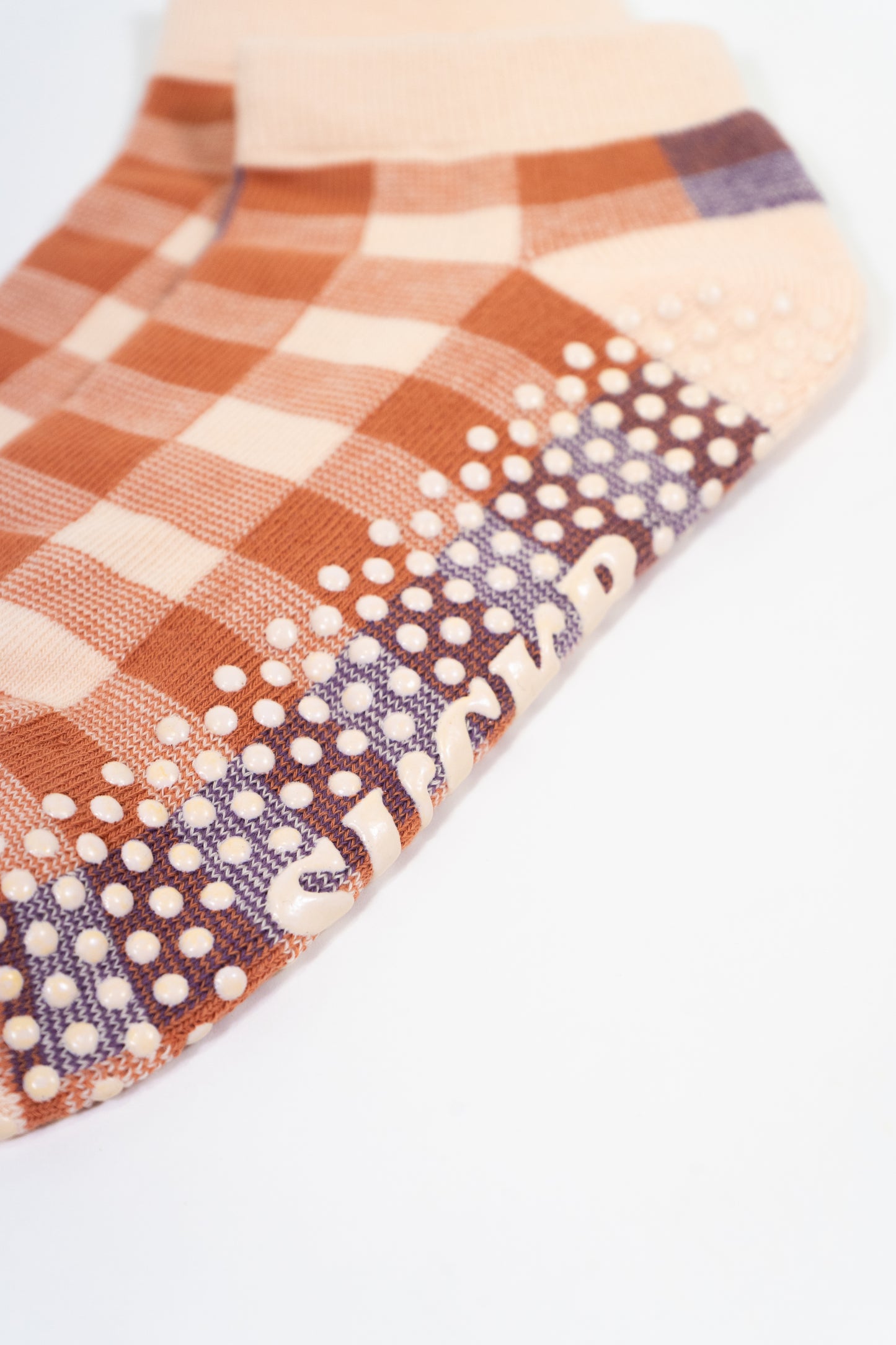 SUCKR pink plaid grip socks, close up detailed