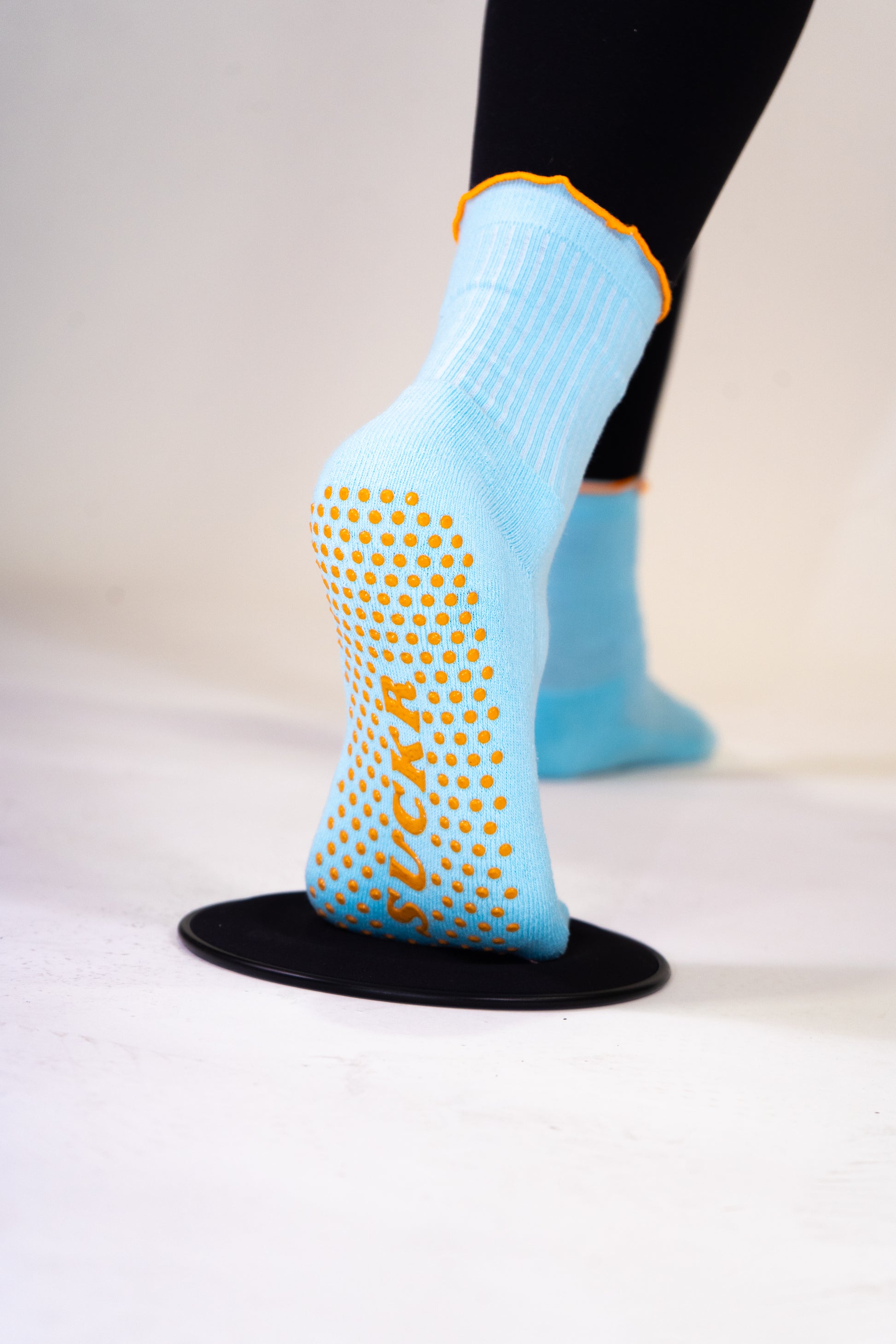 SUCKR  blue frill grip socks, bottom of sole