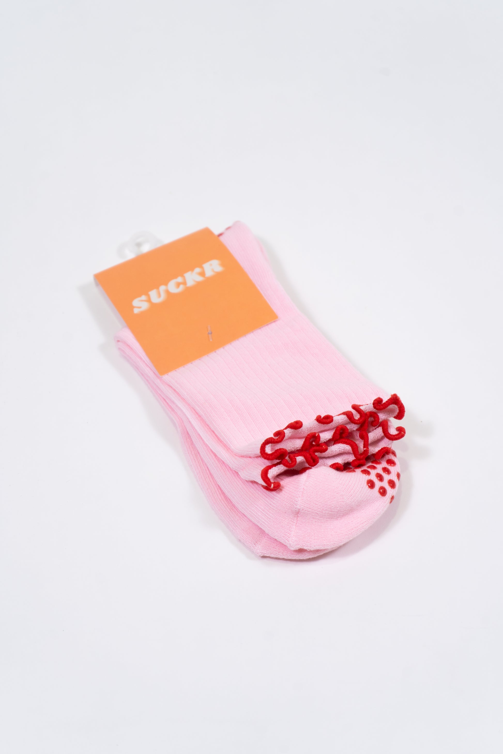 SUCKR Pink frill grip socks, front of packet