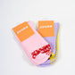 SUCKR princess frill purple and pink grip socks, front of product packet 