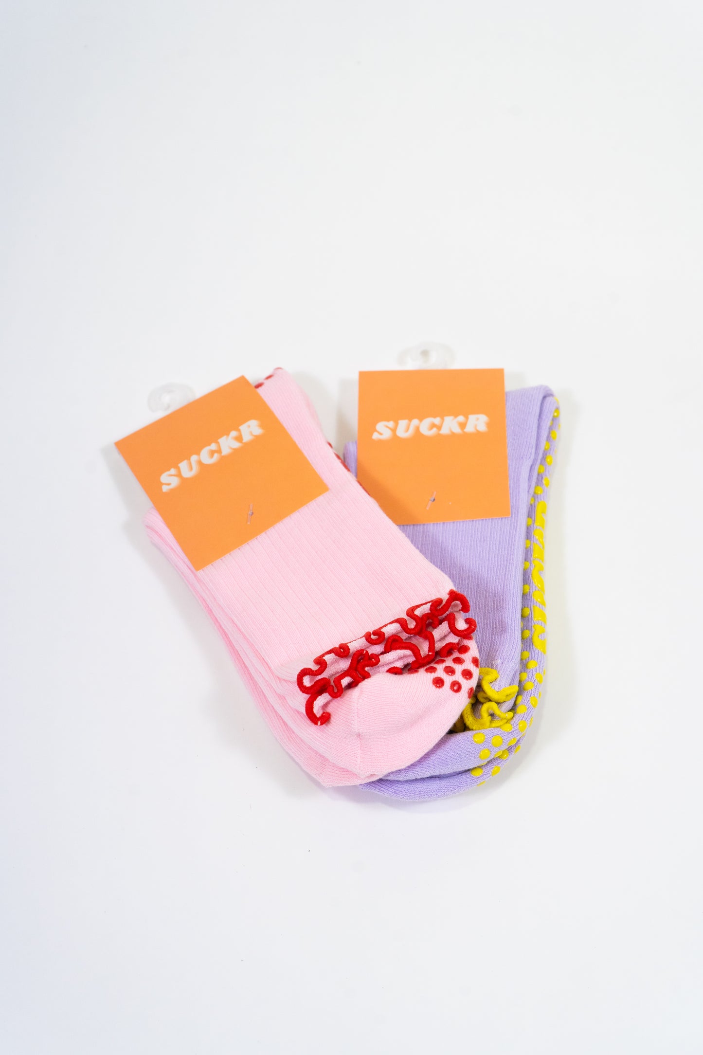 SUCKR princess frill purple and pink grip socks, front of product packet 